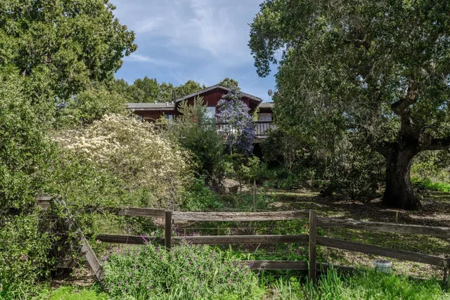 a living room with furniture a book shelf and a book shelf