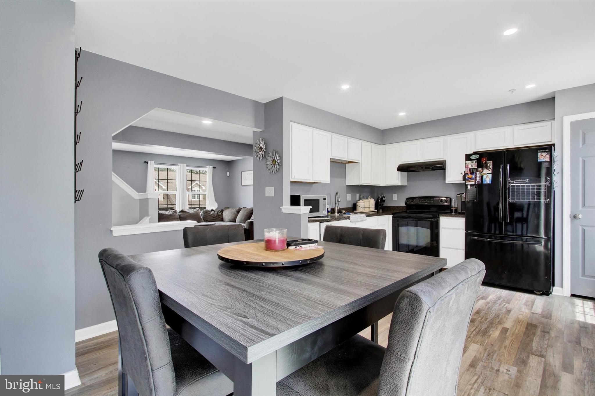 703 Grant Drive Hanover, PA 17331 - Photo 12 of 27 a kitchen with a dining table and chairs