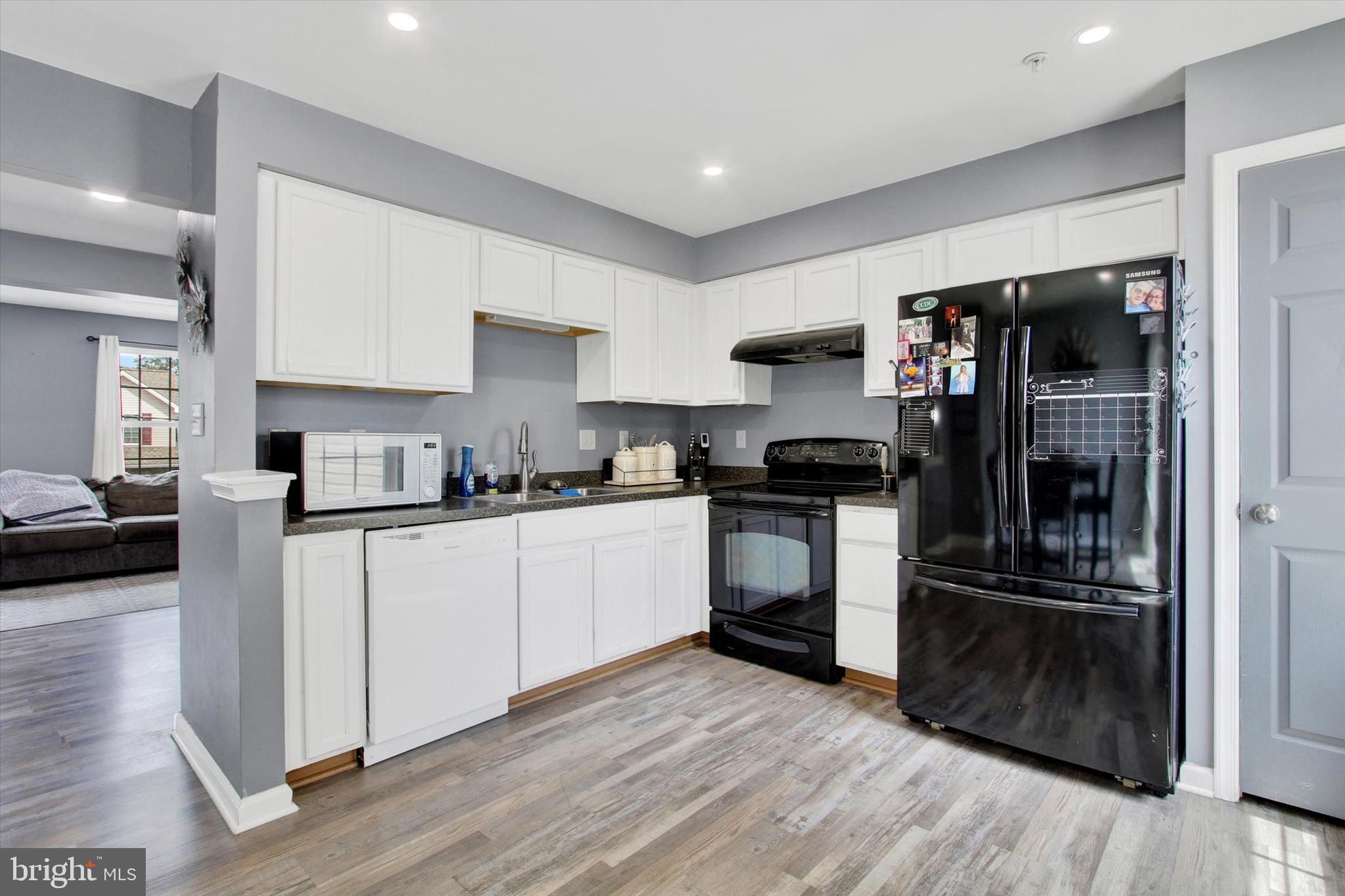 703 Grant Drive Hanover, PA 17331 - Photo 13 of 27 a kitchen with a refrigerator and a stove top oven