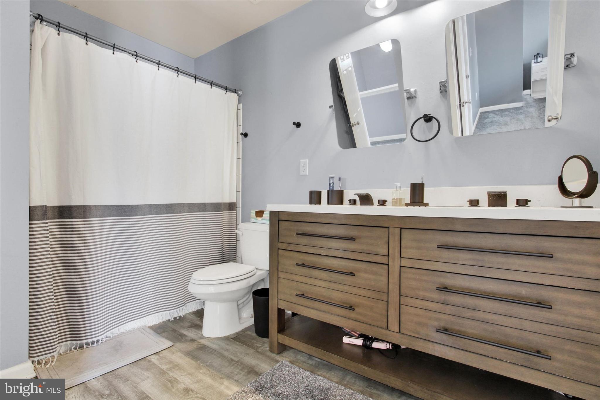 703 Grant Drive Hanover, PA 17331 - Photo 18 of 27 a bathroom with a sink a toilet and mirror
