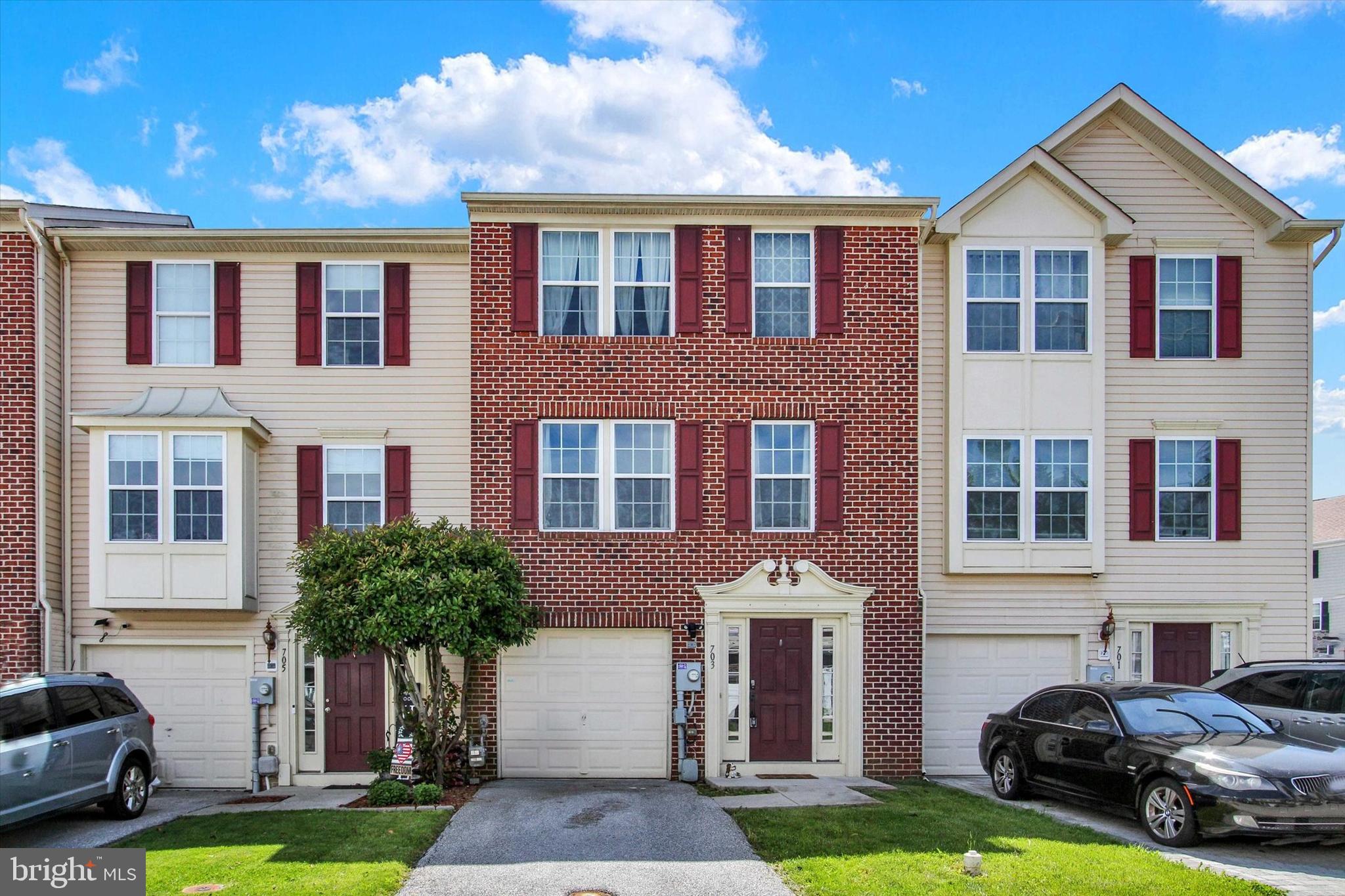 703 Grant Drive Hanover, PA 17331 - Photo 2 of 27 a front view of a house with a yard and garage