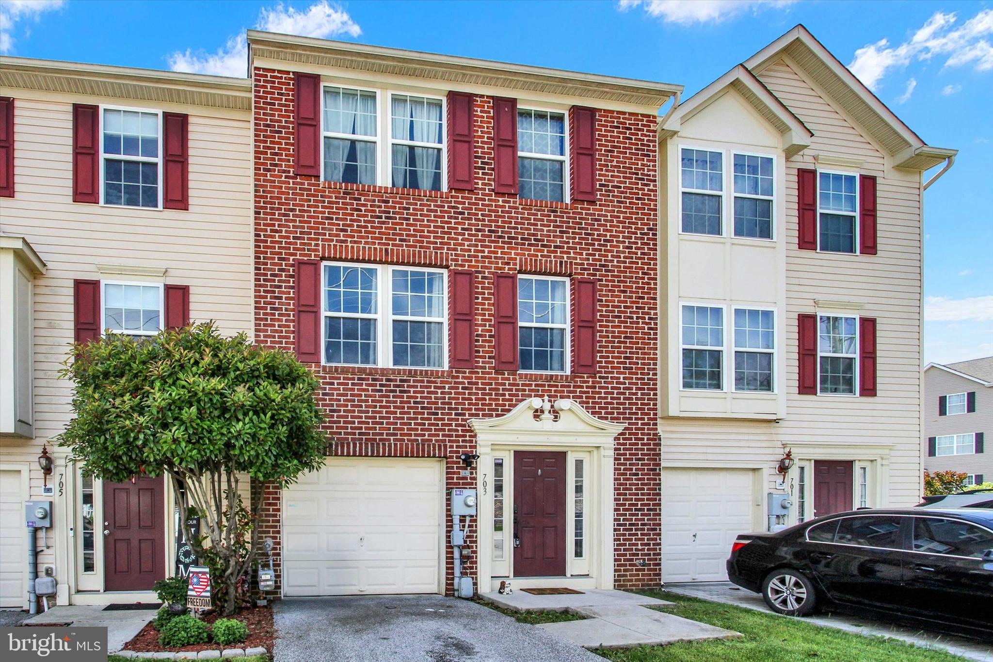 703 Grant Drive Hanover, PA 17331 - Photo 3 of 27 a view of a house with a yard and garage