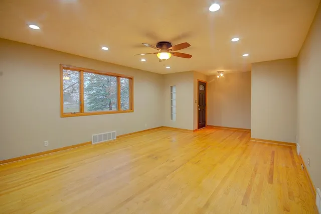 a large kitchen with a sink and dishwasher a refrigerator with a sink