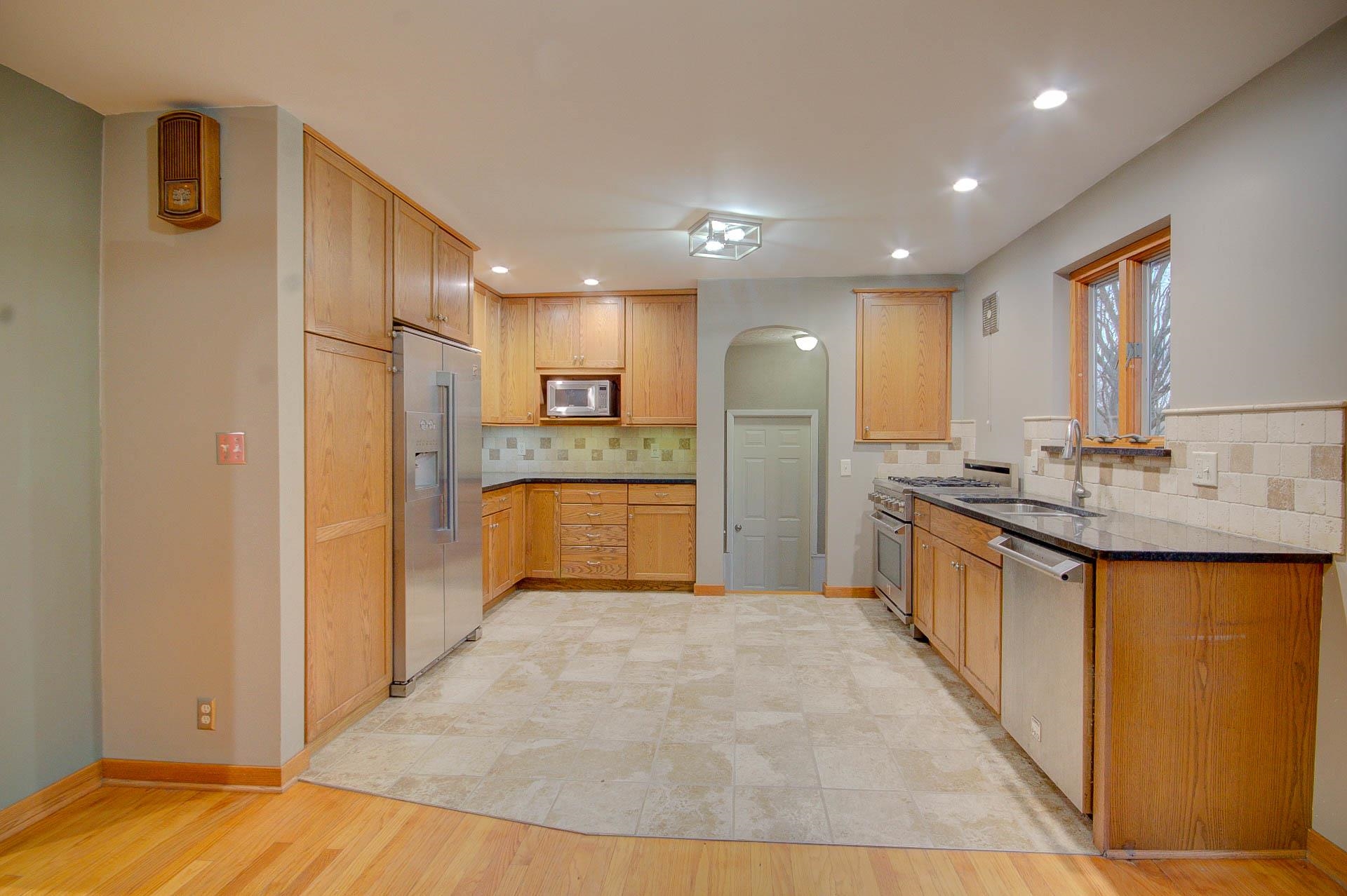 327 4th Street Andover, IL 61233 - Photo 18 of 58 a large kitchen with stainless steel appliances granite countertop a refrigerator and a sink