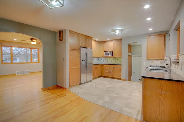 a view of a kitchen with a sink and a window