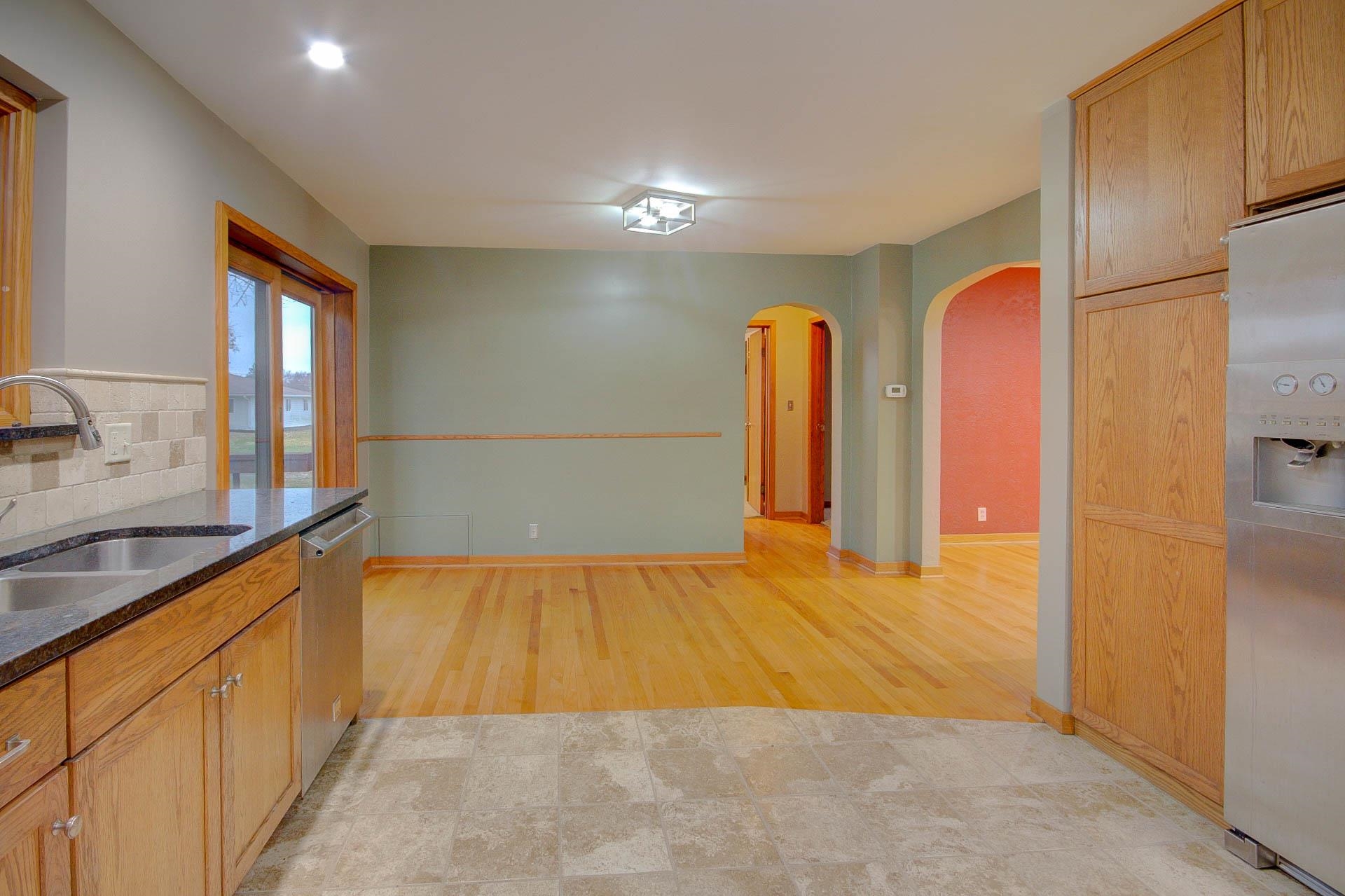 327 4th Street Andover, IL 61233 - Photo 23 of 58 a view of a kitchen with a sink and a refrigerator