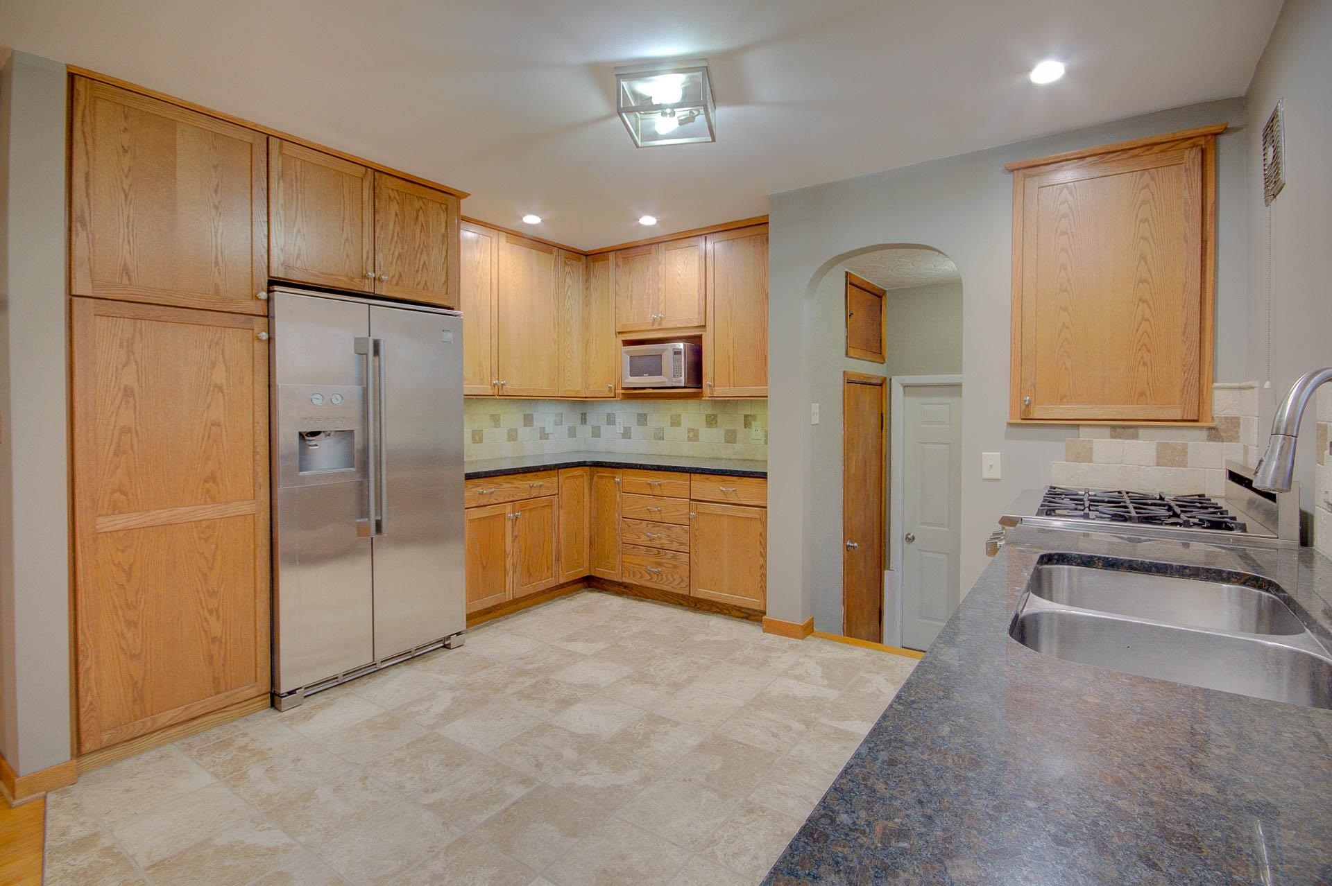 327 4th Street Andover, IL 61233 - Photo 24 of 58 a kitchen with stainless steel appliances granite countertop a refrigerator and a stove
