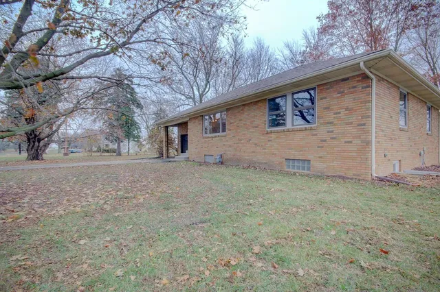 a backyard of a house with lots of green space