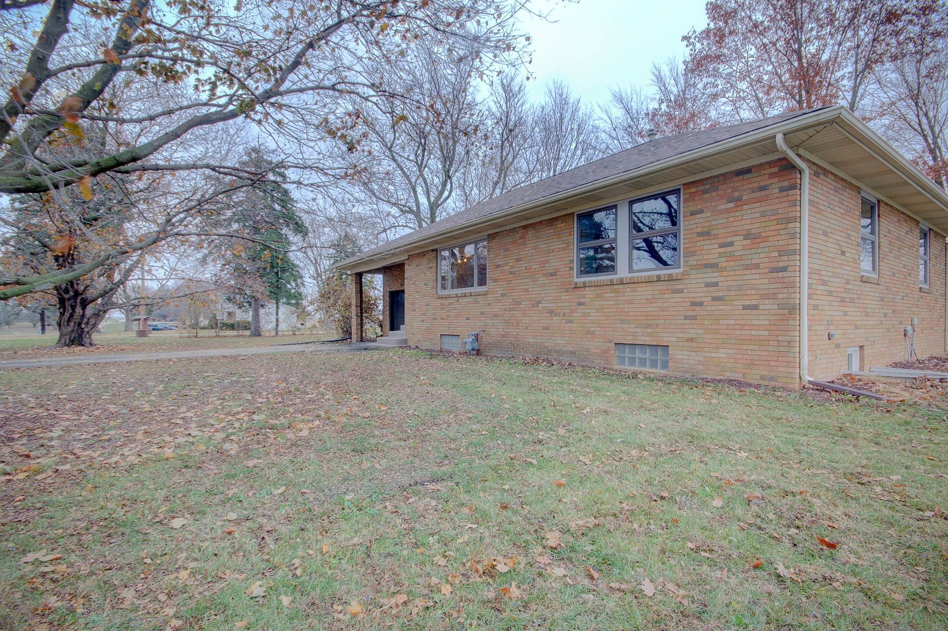 327 4th Street Andover, IL 61233 - Photo 4 of 58 a house view with a backyard space