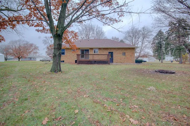 a house that has a tree in front of it