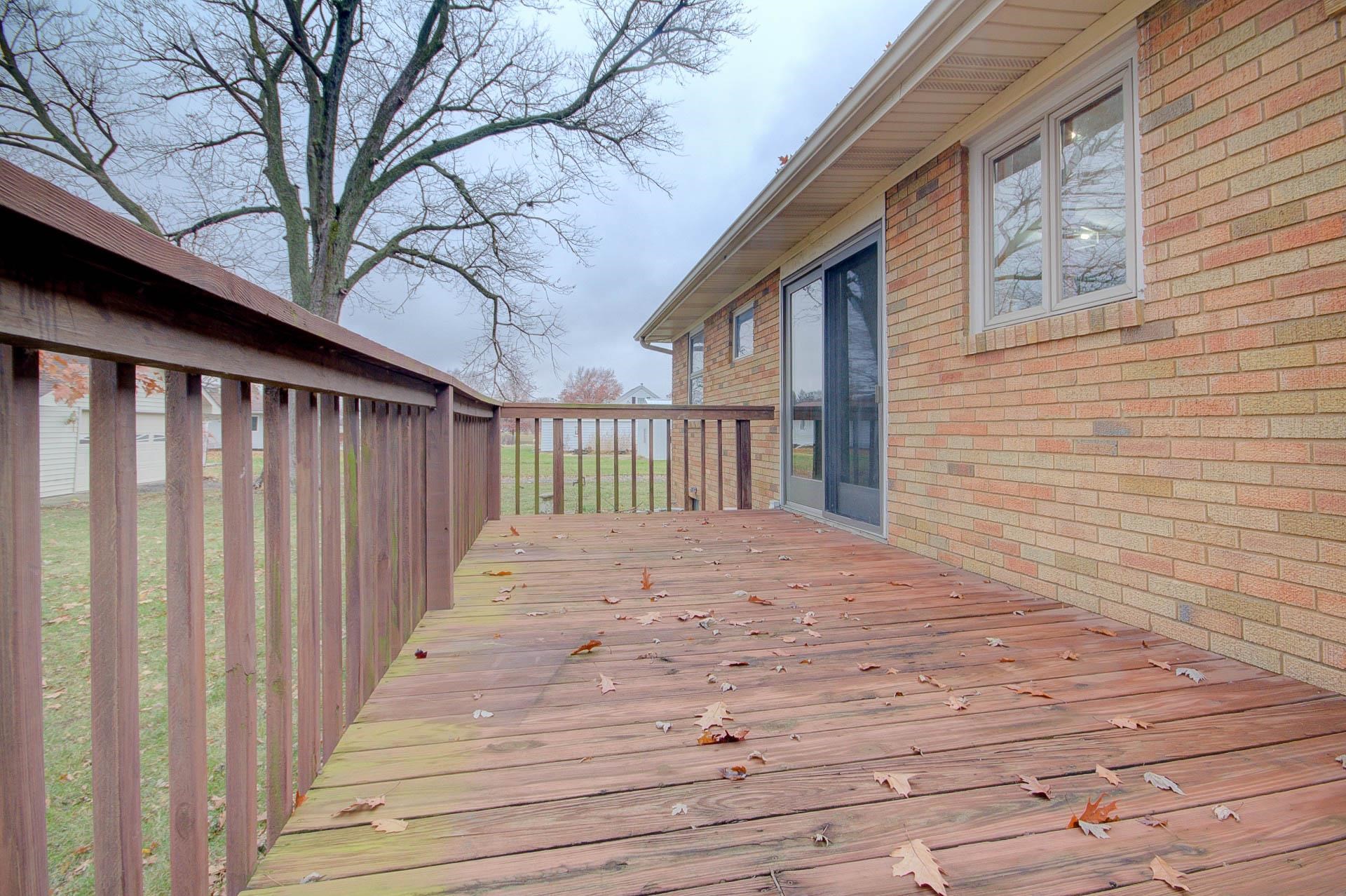 327 4th Street Andover, IL 61233 - Photo 7 of 58 a view of a backyard with wooden fence and large trees