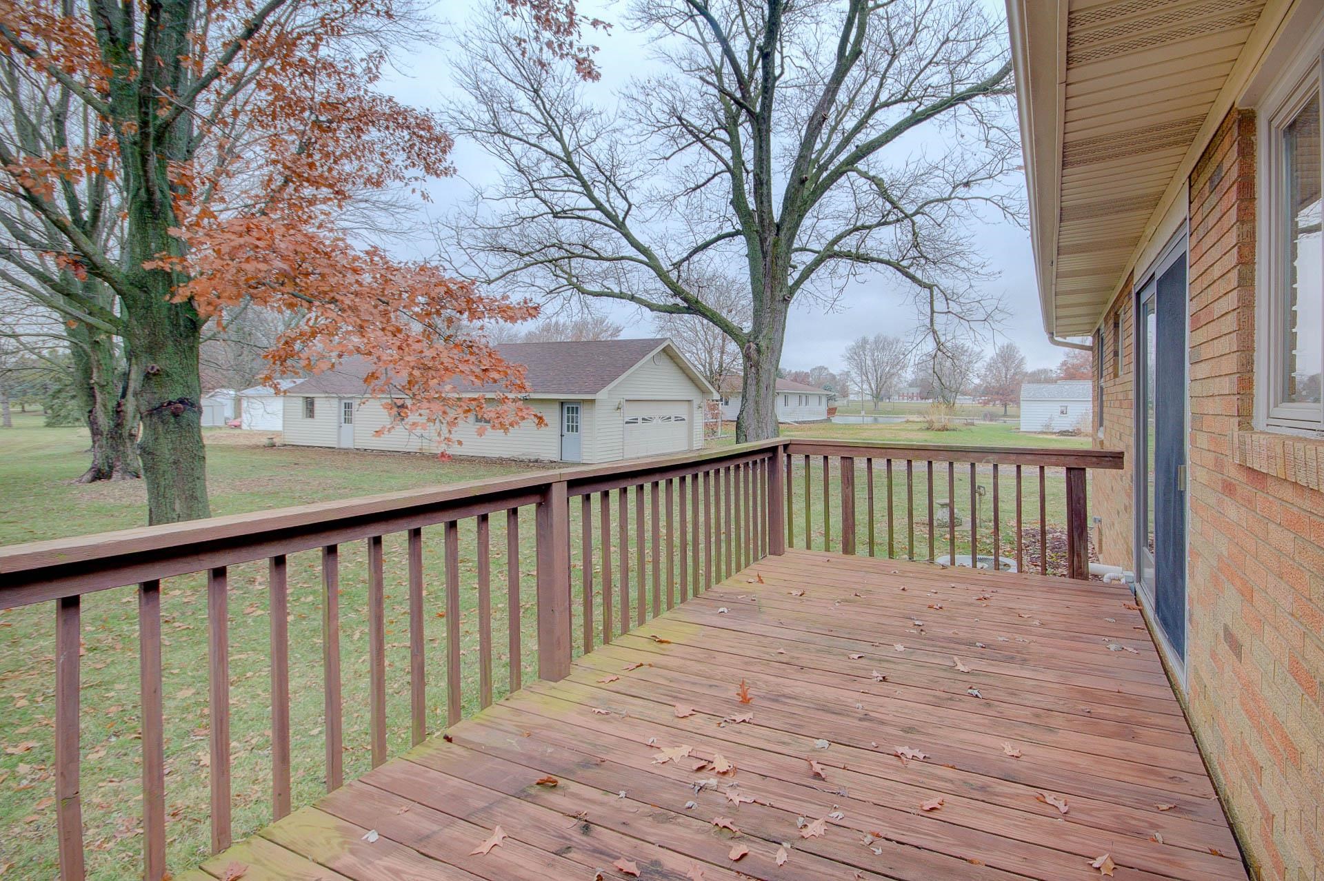 327 4th Street Andover, IL 61233 - Photo 8 of 58 a balcony with wooden floor and fence