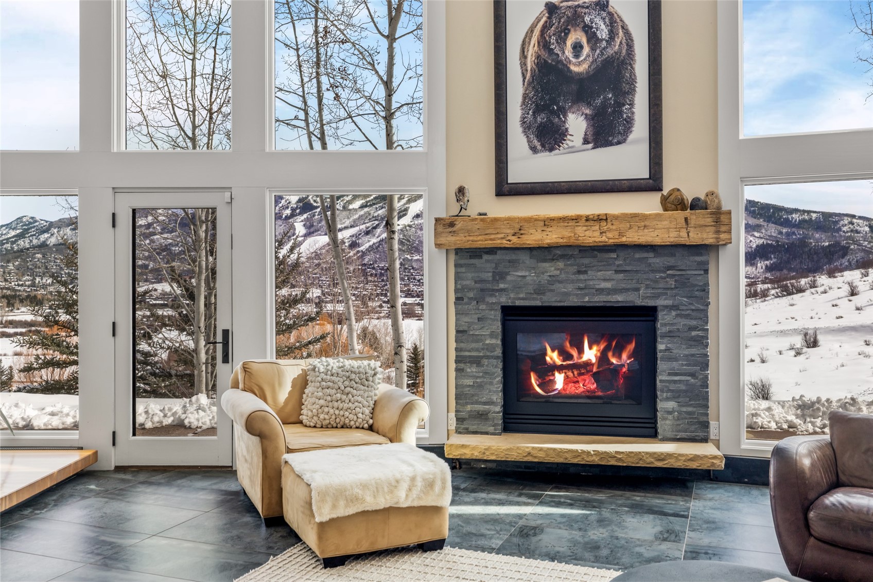 31655 Sugar Ridge Road Steamboat Springs, CO 80487 - Photo 10 of 49 a living room with furniture and a fireplace