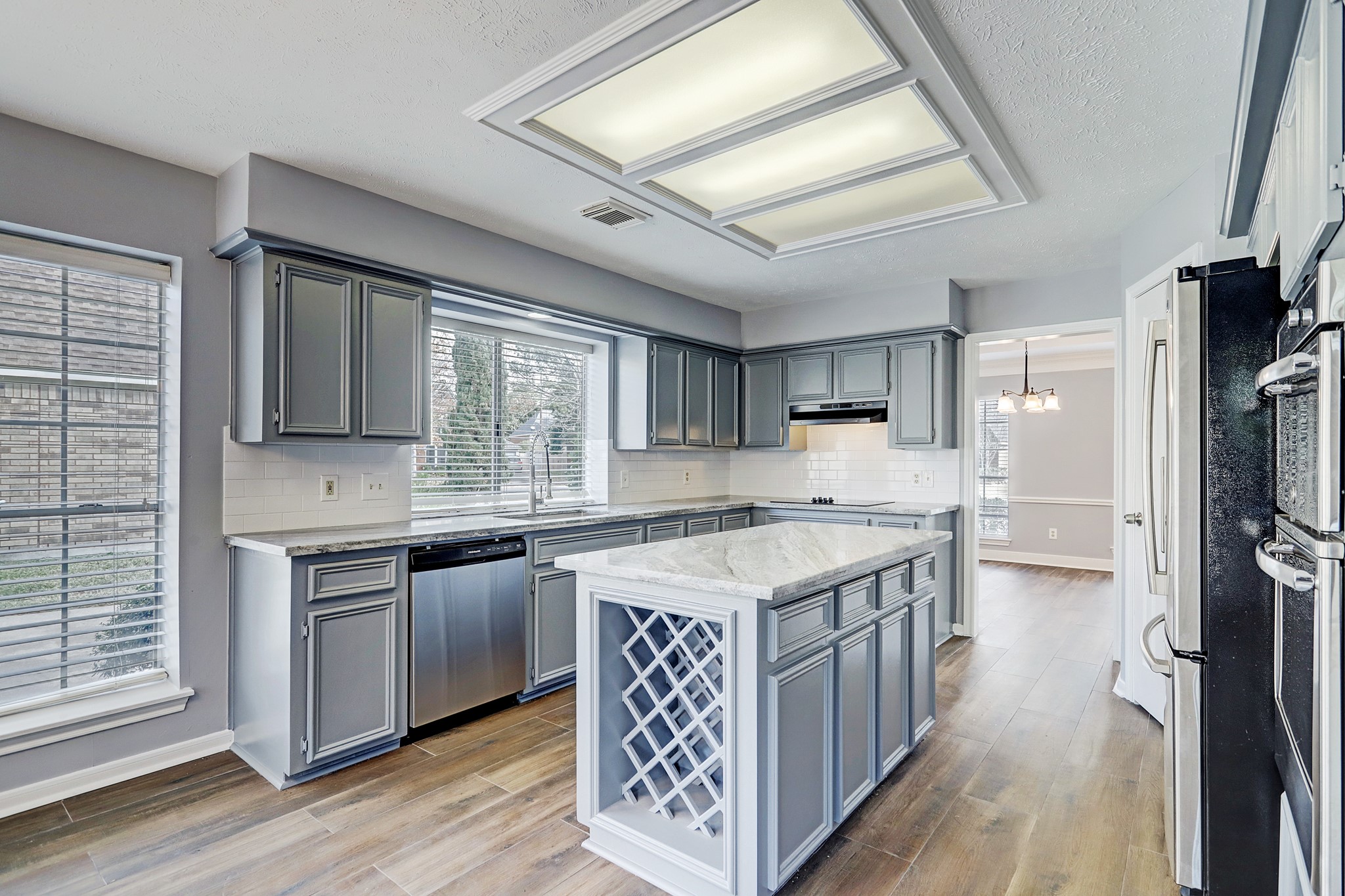 7403 Manor Bridge Court Houston, TX 77095 - Photo 3 of 11 a kitchen with stainless steel appliances granite countertop a stove and a refrigerator