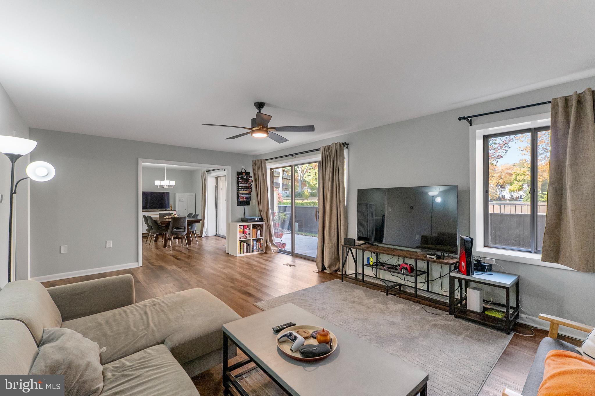 10067 Windstream Drive, Unit 2 Columbia, MD 21044 - Photo 13 of 30 a living room with furniture and a flat screen tv