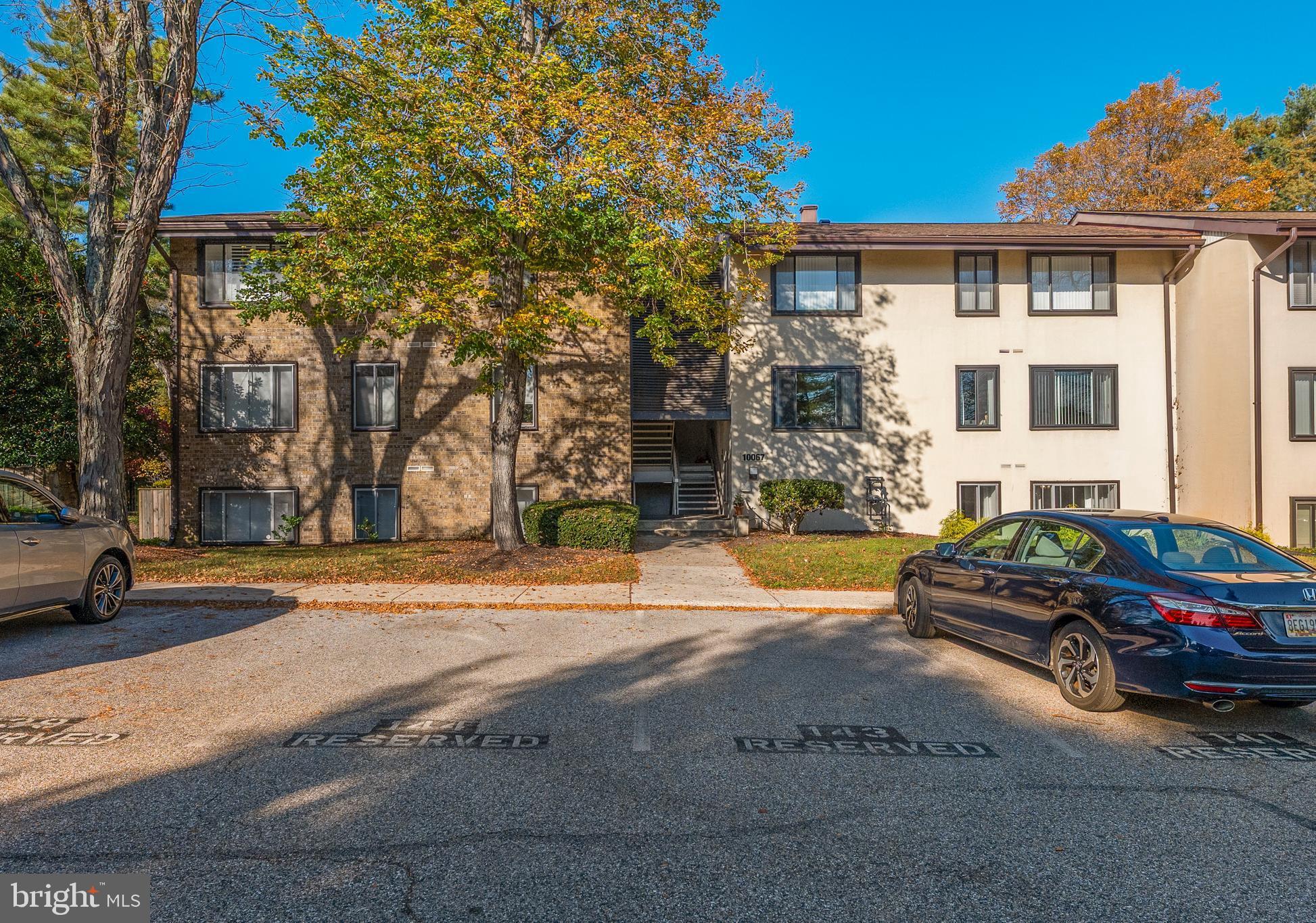 10067 Windstream Drive, Unit 2 Columbia, MD 21044 - Photo 27 of 30 a front view of a house with a garden