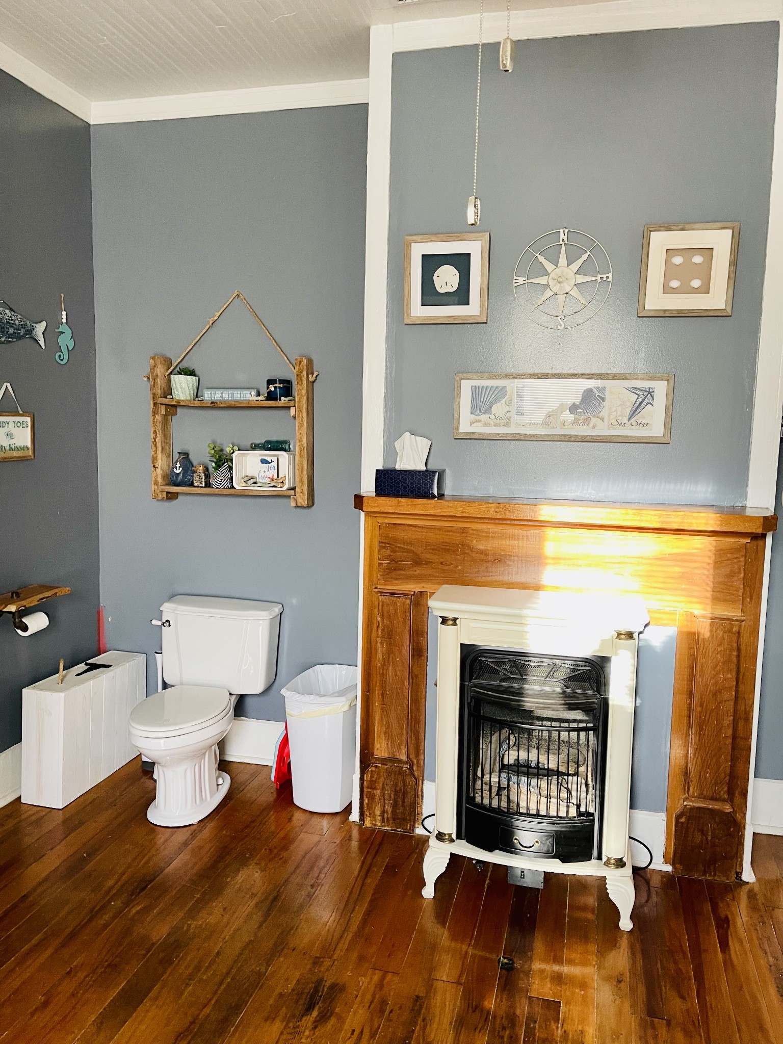 830 Red Hill Road Normandy, TN 37360 - Photo 27 of 56 a living room with a fireplace wooden floor and a table