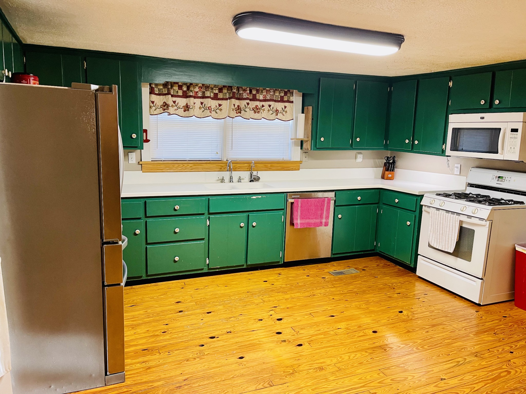 830 Red Hill Road Normandy, TN 37360 - Photo 37 of 56 a kitchen with kitchen island a sink stainless steel appliances and cabinets