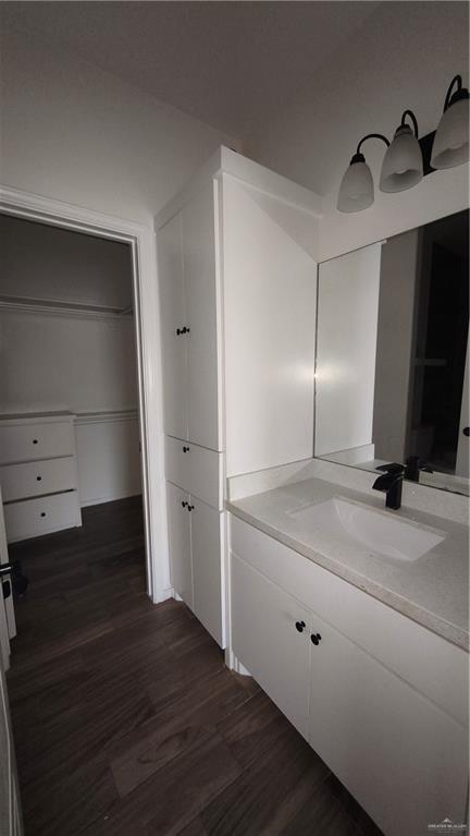 941 South Indiana Avenue, Unit B Mercedes, TX 78570 - Photo 13 of 16 a bathroom with a sink and a mirror