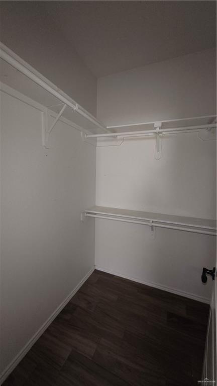 941 South Indiana Avenue, Unit B Mercedes, TX 78570 - Photo 9 of 16 a view of a room with wooden floor