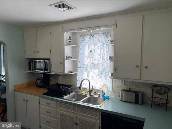 a bathroom with a toilet a sink and a shower