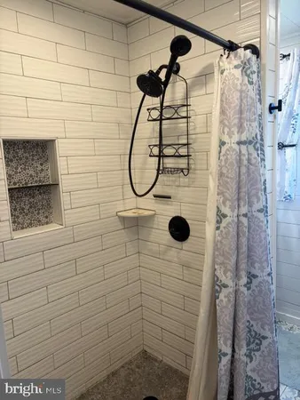 a bedroom with bed and window