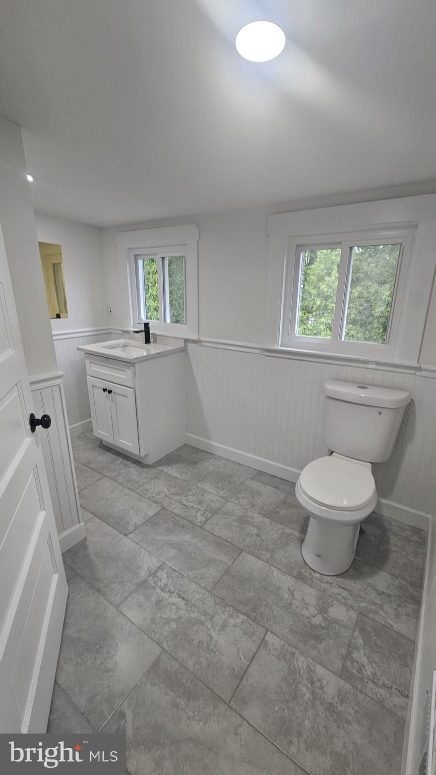 471 Glassboro Road Woodbury Heights, NJ 08097 - Photo 17 of 21 a bathroom with a toilet sink and window