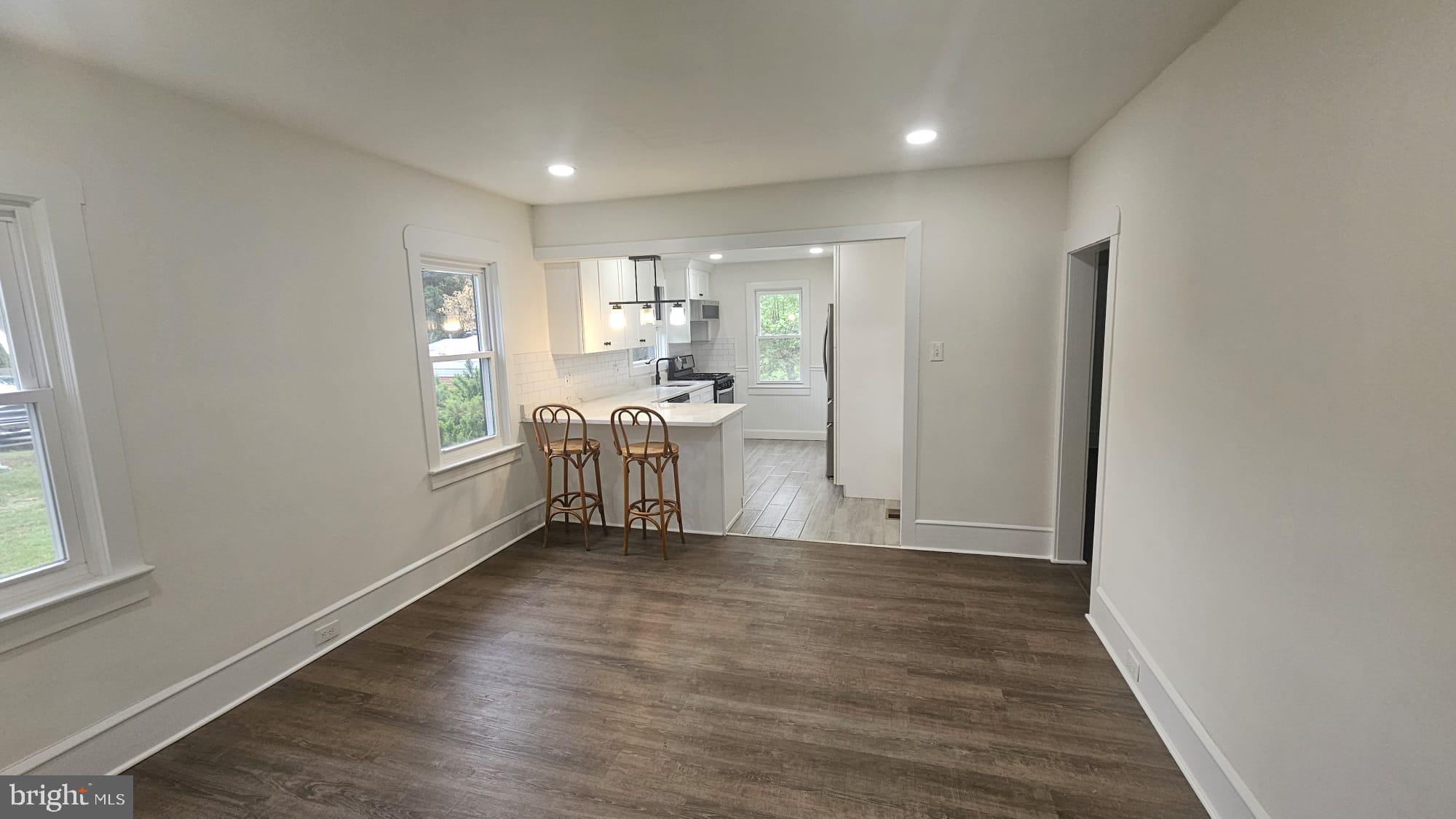 471 Glassboro Road Woodbury Heights, NJ 08097 - Photo 7 of 21 a view of empty room with wooden floor and fan