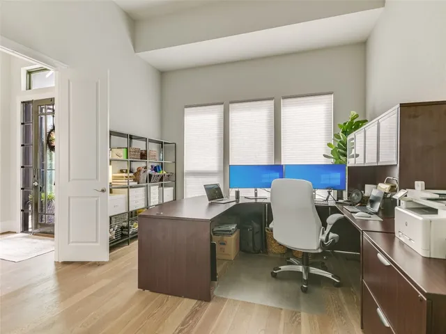 a workspace with furniture and wooden floor