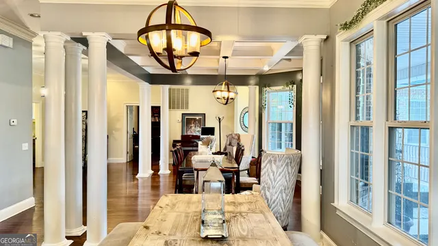 a view of living room with furniture and floor to ceiling window