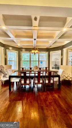 a room with lots of furniture and wooden floor
