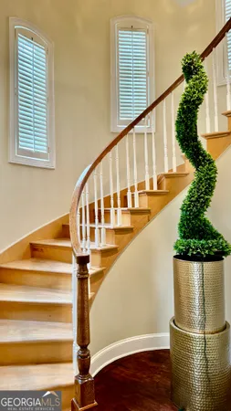 a view of entryway with wooden floor and stairs