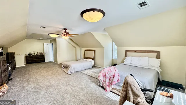 a bathroom with a sink and mirror with toilet