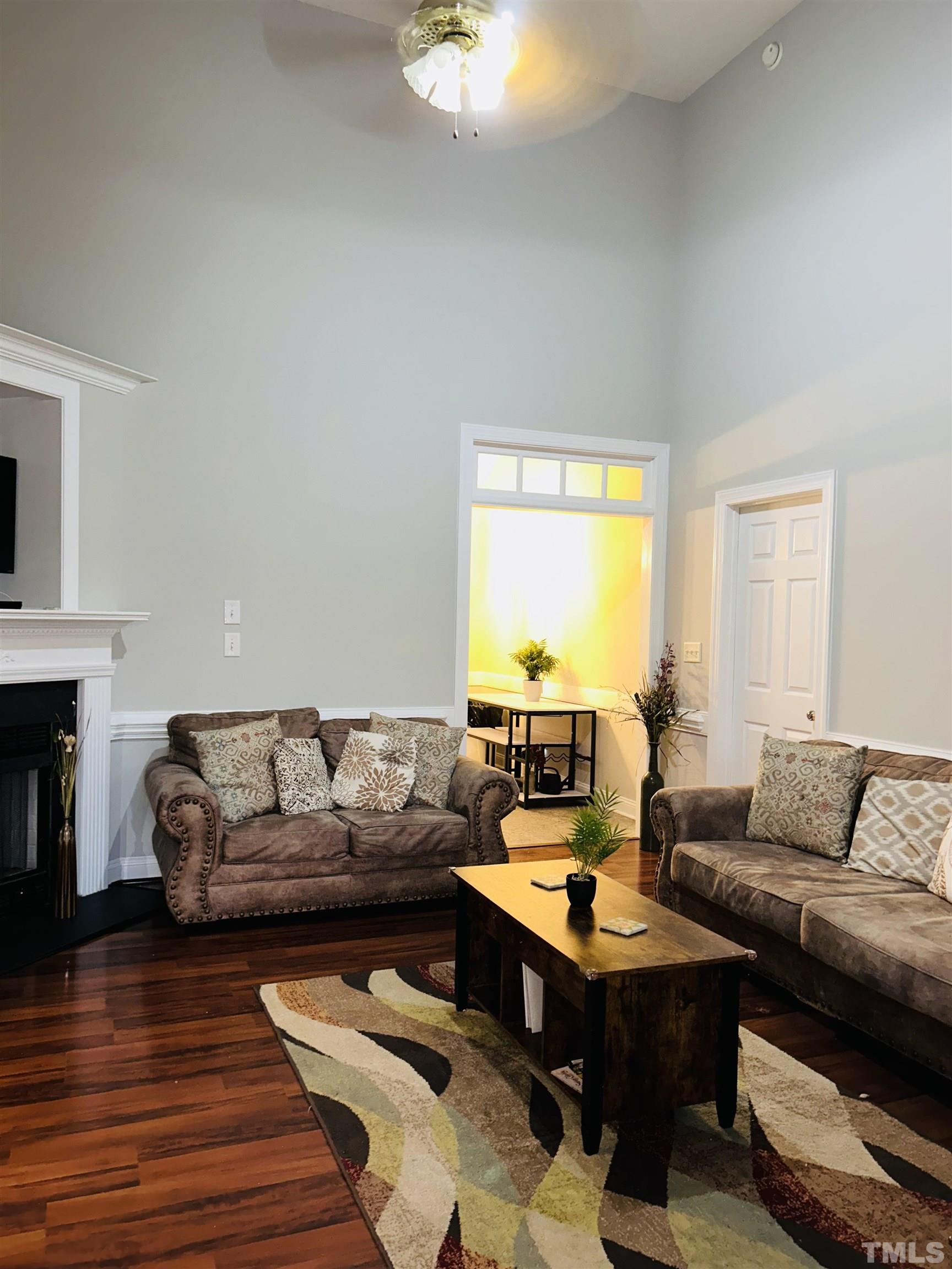5524 Scuppernong Road Wilson, NC 27893 - Photo 13 of 37 a living room with furniture and a wooden floor