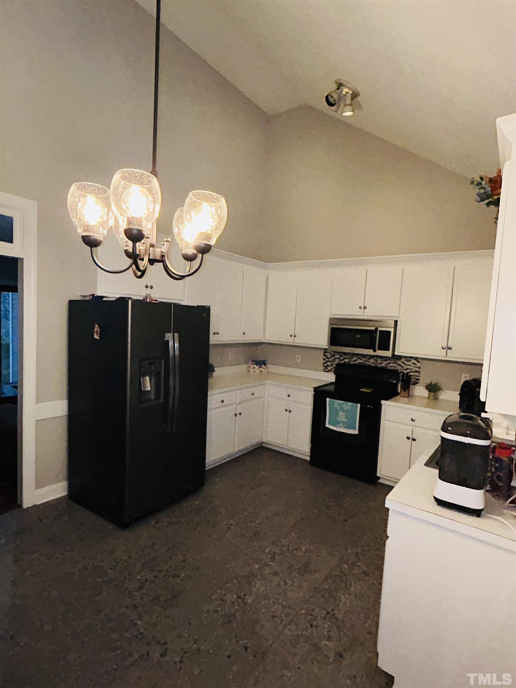 5524 Scuppernong Road Wilson, NC 27893 - Photo 16 of 37 a kitchen with cabinets and window