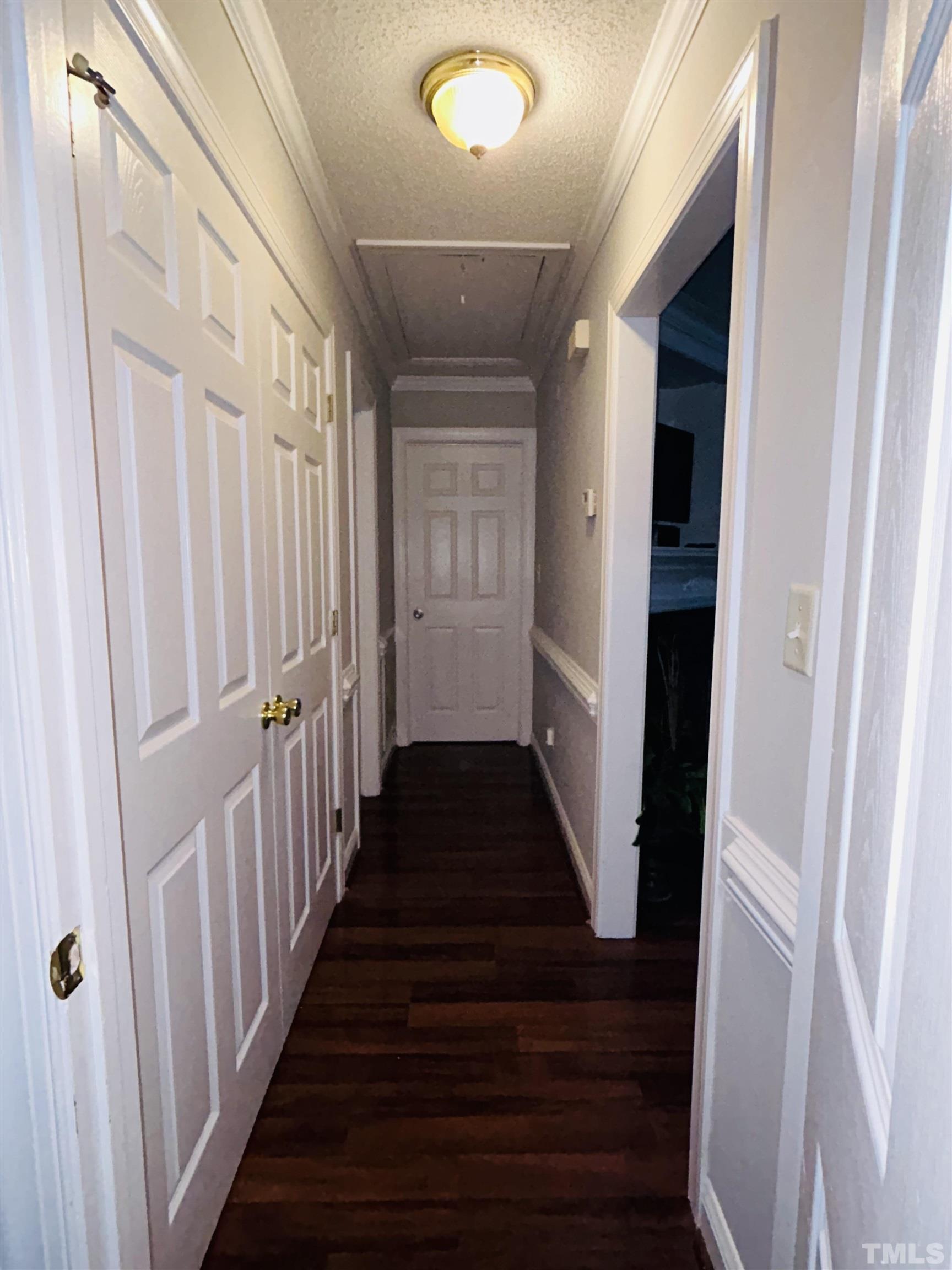 5524 Scuppernong Road Wilson, NC 27893 - Photo 22 of 37 a view of a hallway with wooden floor and staircase