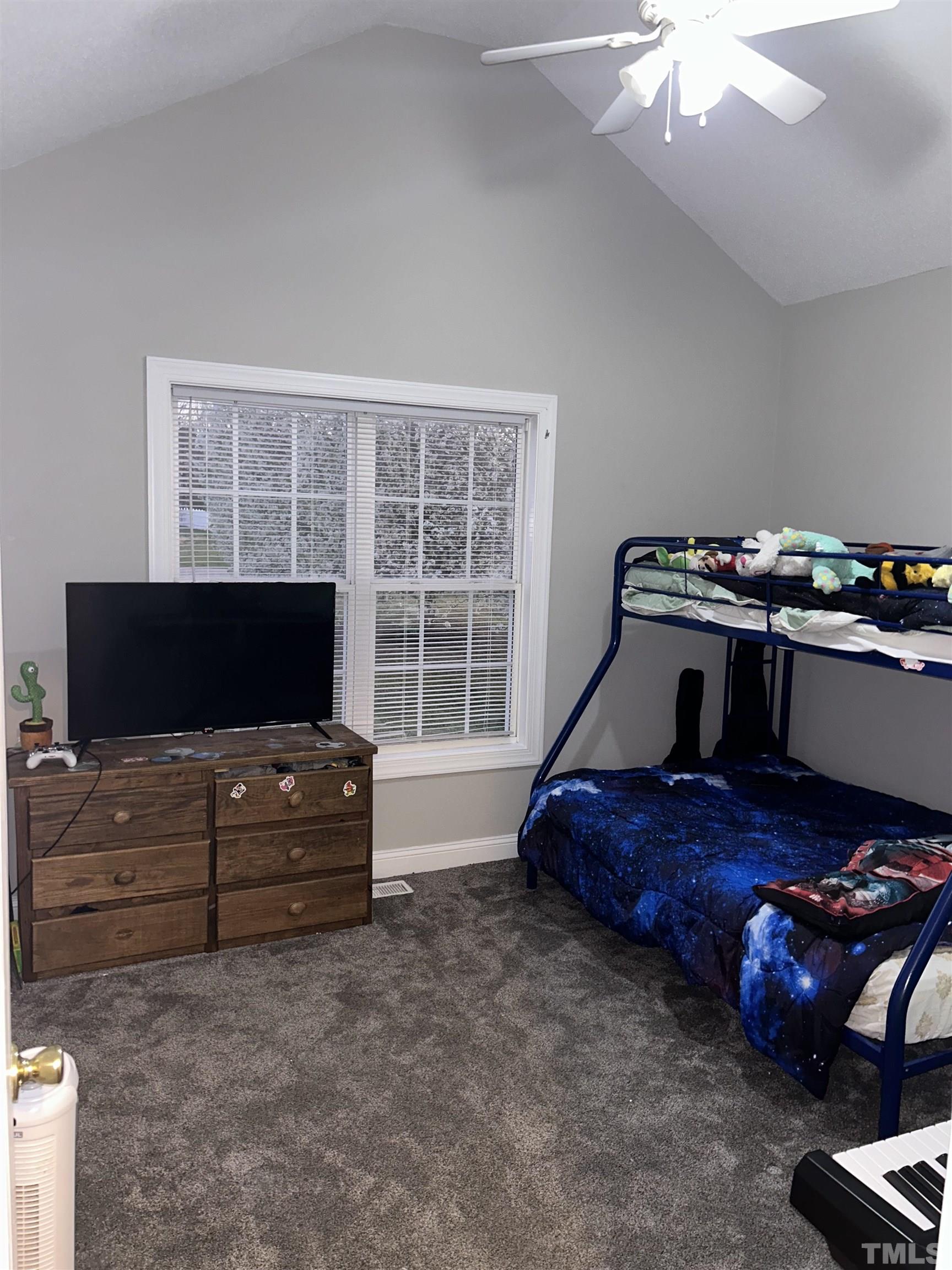 5524 Scuppernong Road Wilson, NC 27893 - Photo 26 of 37 a living room with furniture and a flat screen tv