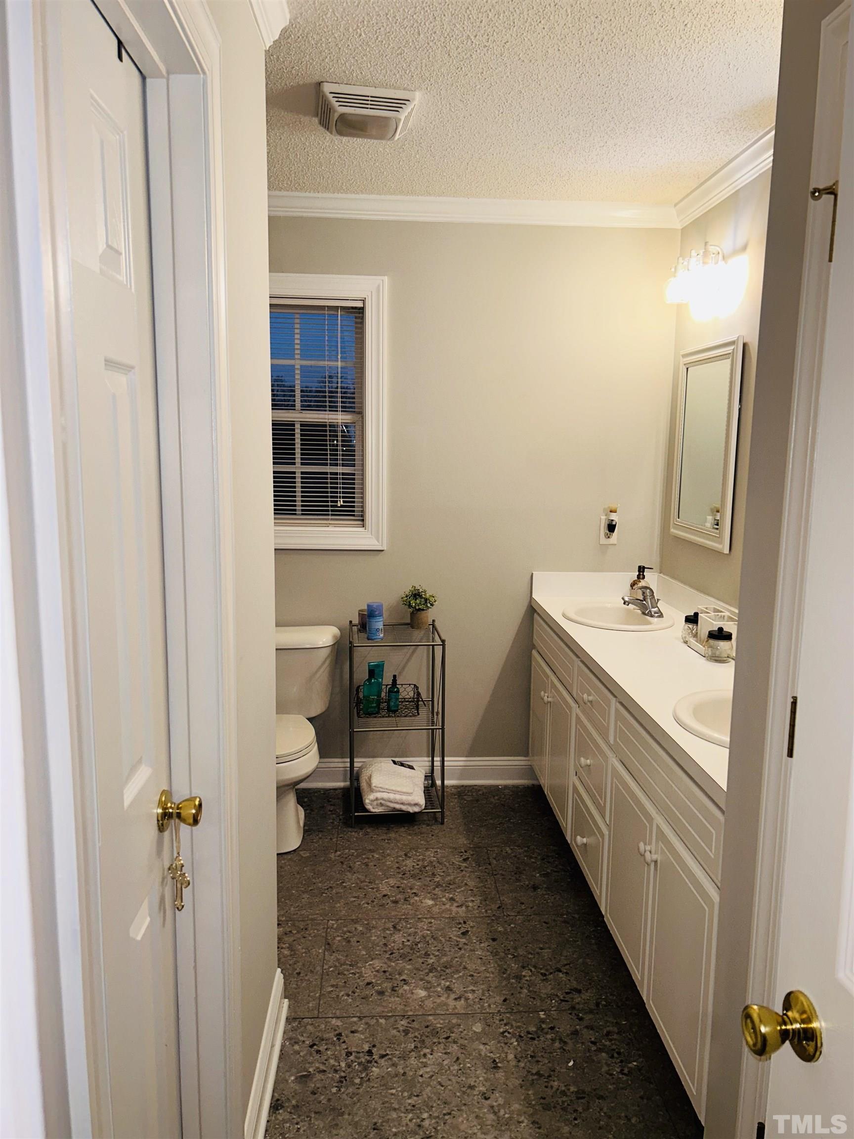 5524 Scuppernong Road Wilson, NC 27893 - Photo 28 of 37 a bathroom with a sink and a mirror