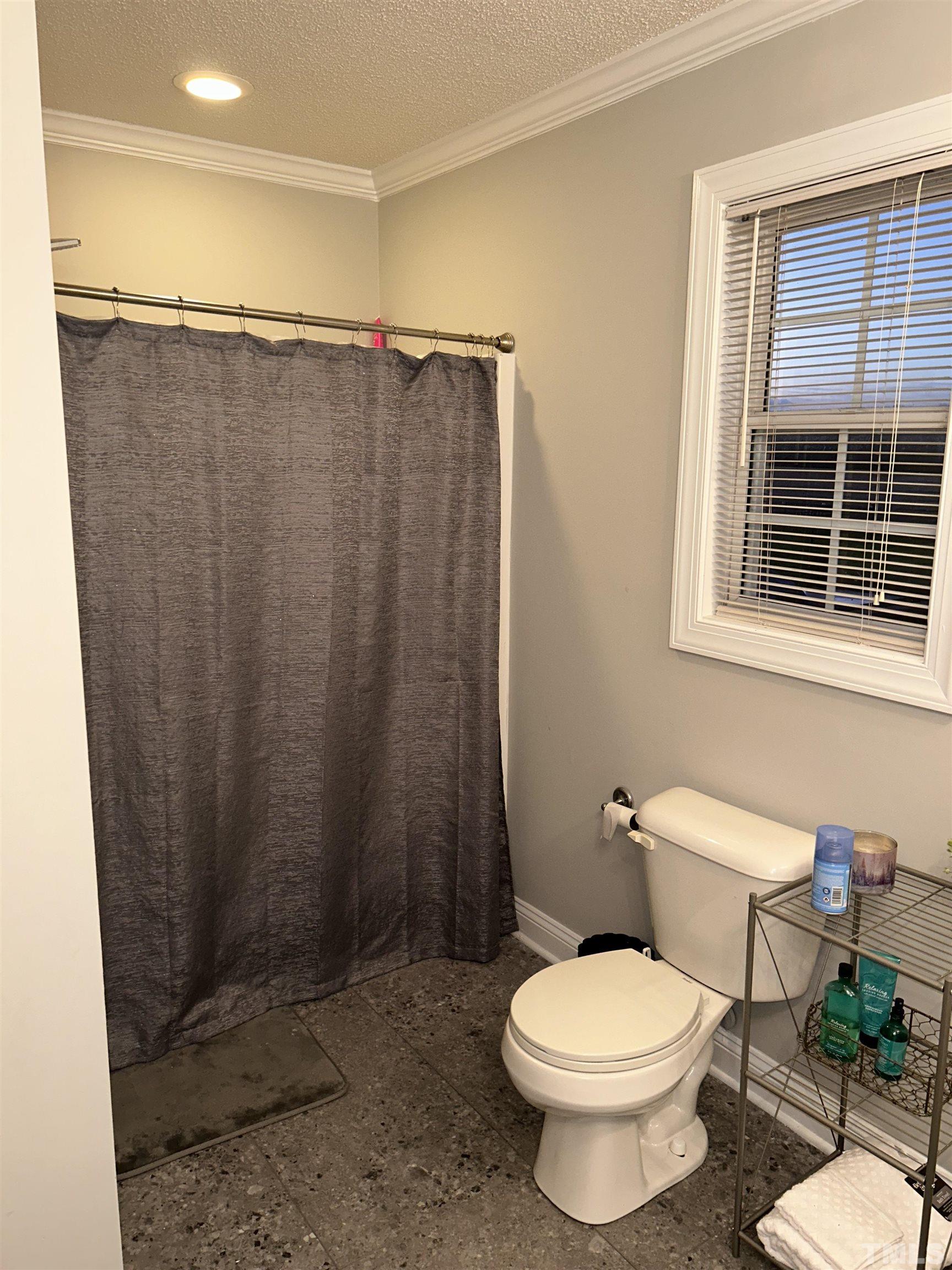 5524 Scuppernong Road Wilson, NC 27893 - Photo 29 of 37 a bathroom with a toilet and a shower