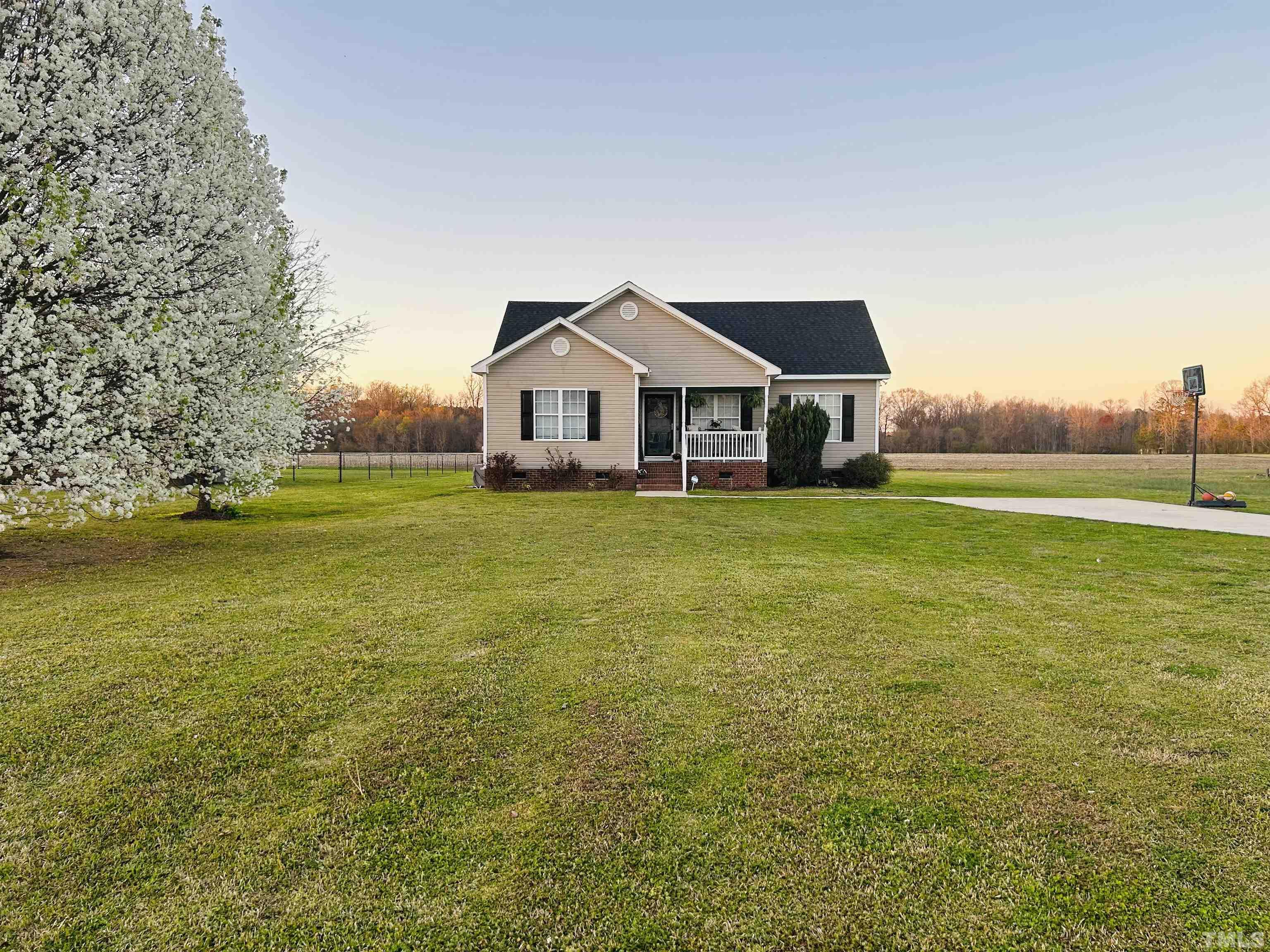 5524 Scuppernong Road Wilson, NC 27893 - Photo 5 of 37 a front view of a house with a yard
