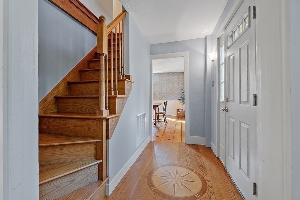 161 Haggetts Pond Road Andover, MA 01810 - Photo 3 of 34 a view of a hallway with wooden floor and entryway