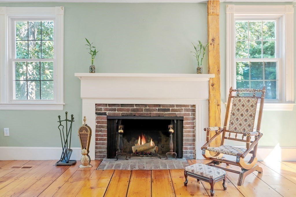 161 Haggetts Pond Road Andover, MA 01810 - Photo 4 of 34 a living room with furniture and a fireplace