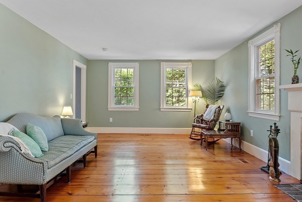 161 Haggetts Pond Road Andover, MA 01810 - Photo 6 of 34 a living room with furniture gym equipment and a large window