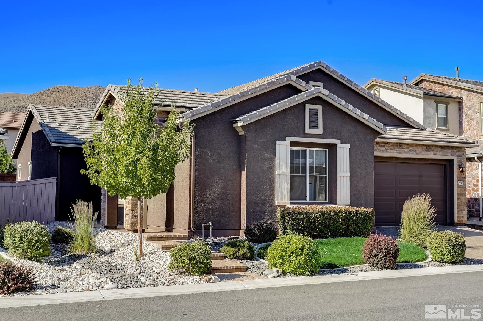 2845 Bonfire Lane Reno, NV 89521 - Photo 11 of 26 a front view of a house with a yard