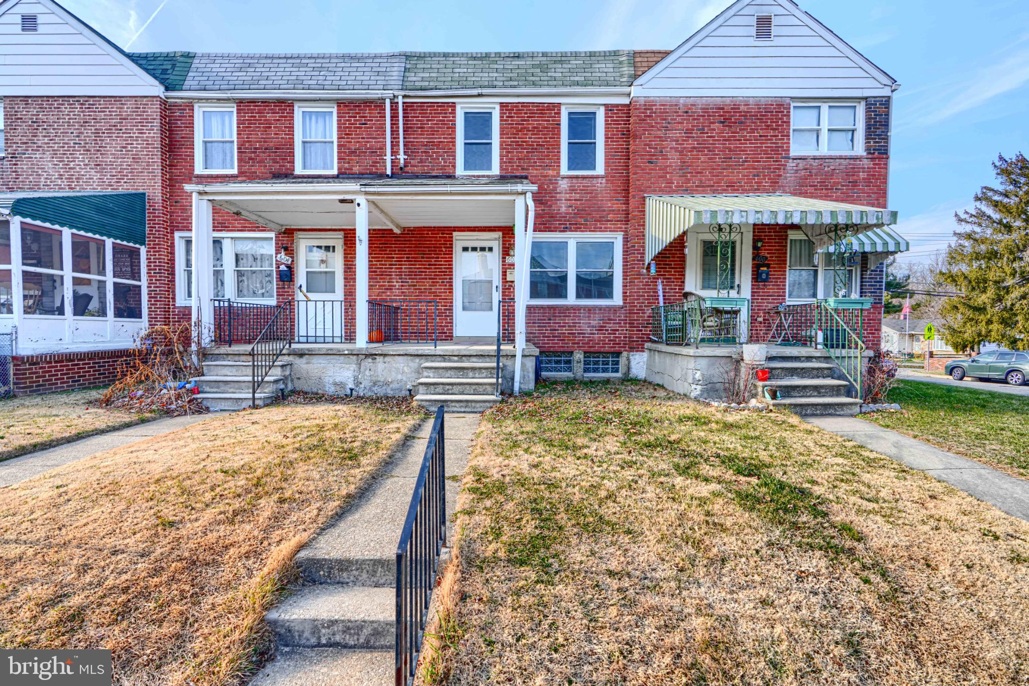 Charming brick townhomes with inviting porches.