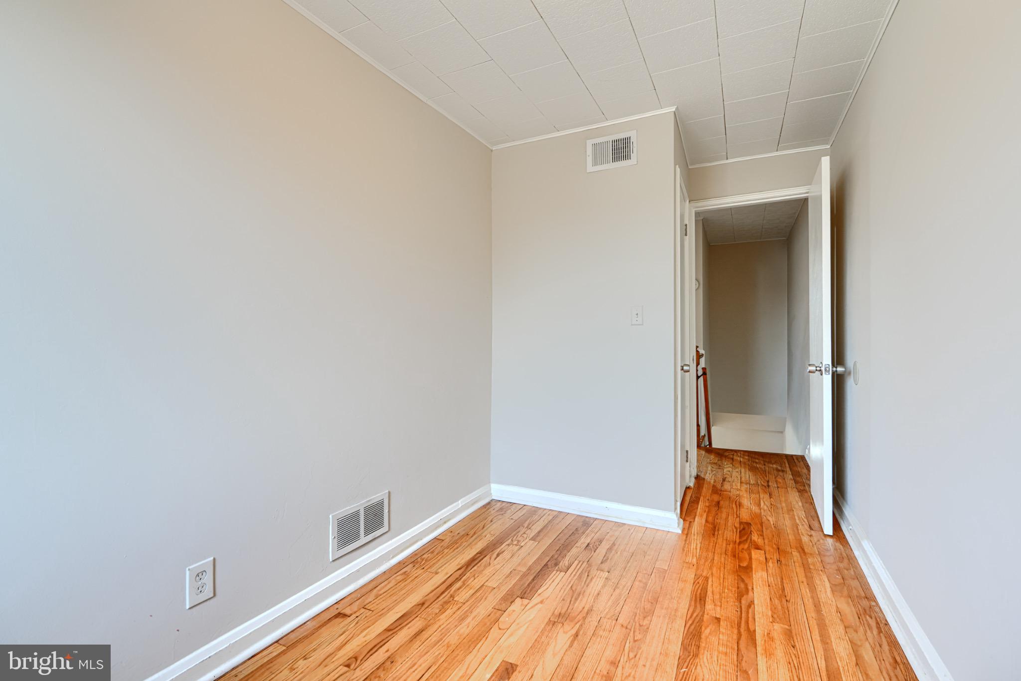 602 Aldworth Road Dundalk, MD 21222 - Photo 13 of 27 Bright and airy hallway with hardwood floors.