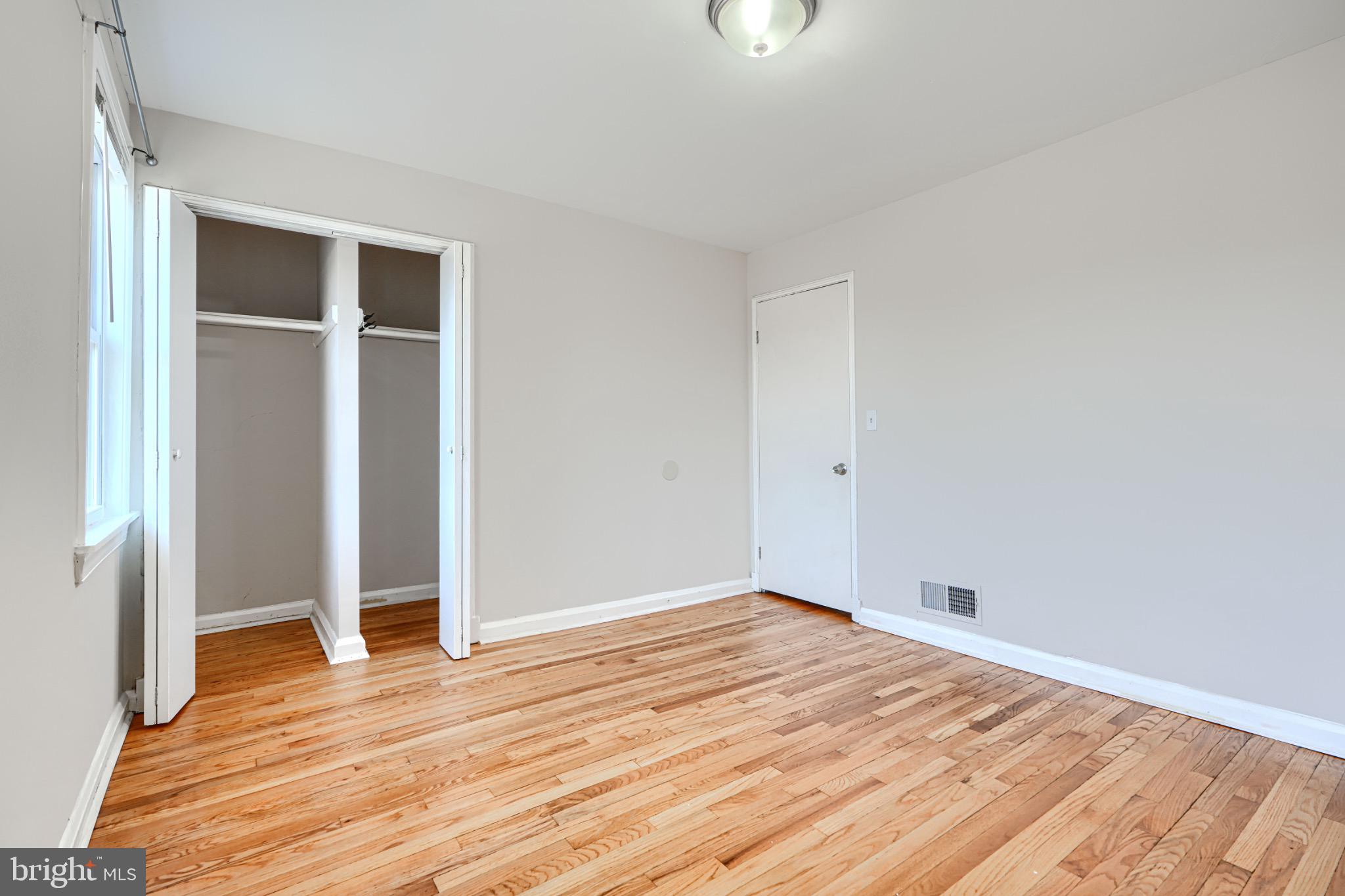 602 Aldworth Road Dundalk, MD 21222 - Photo 19 of 27 Bright and airy room with hardwood floors.