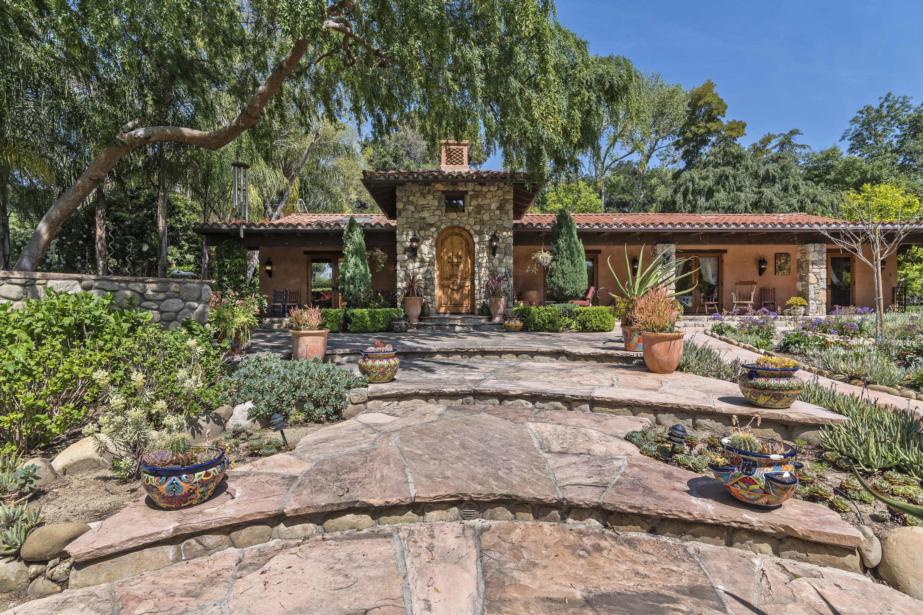 a front view of a house with garden