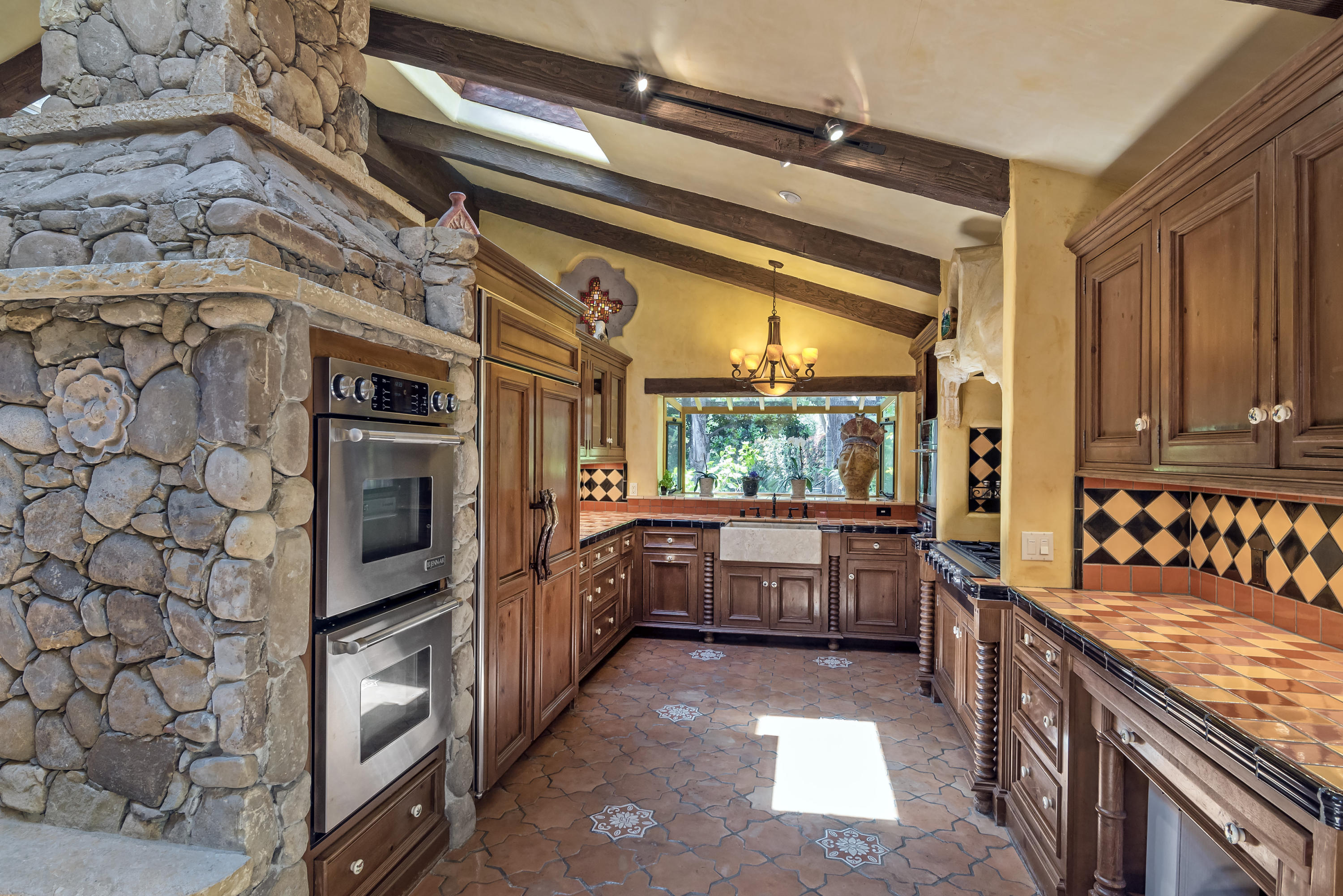 129 Grapevine Road Oak View, CA 93022 - Photo 11 of 24 a kitchen with stainless steel appliances granite countertop a sink and stove top oven