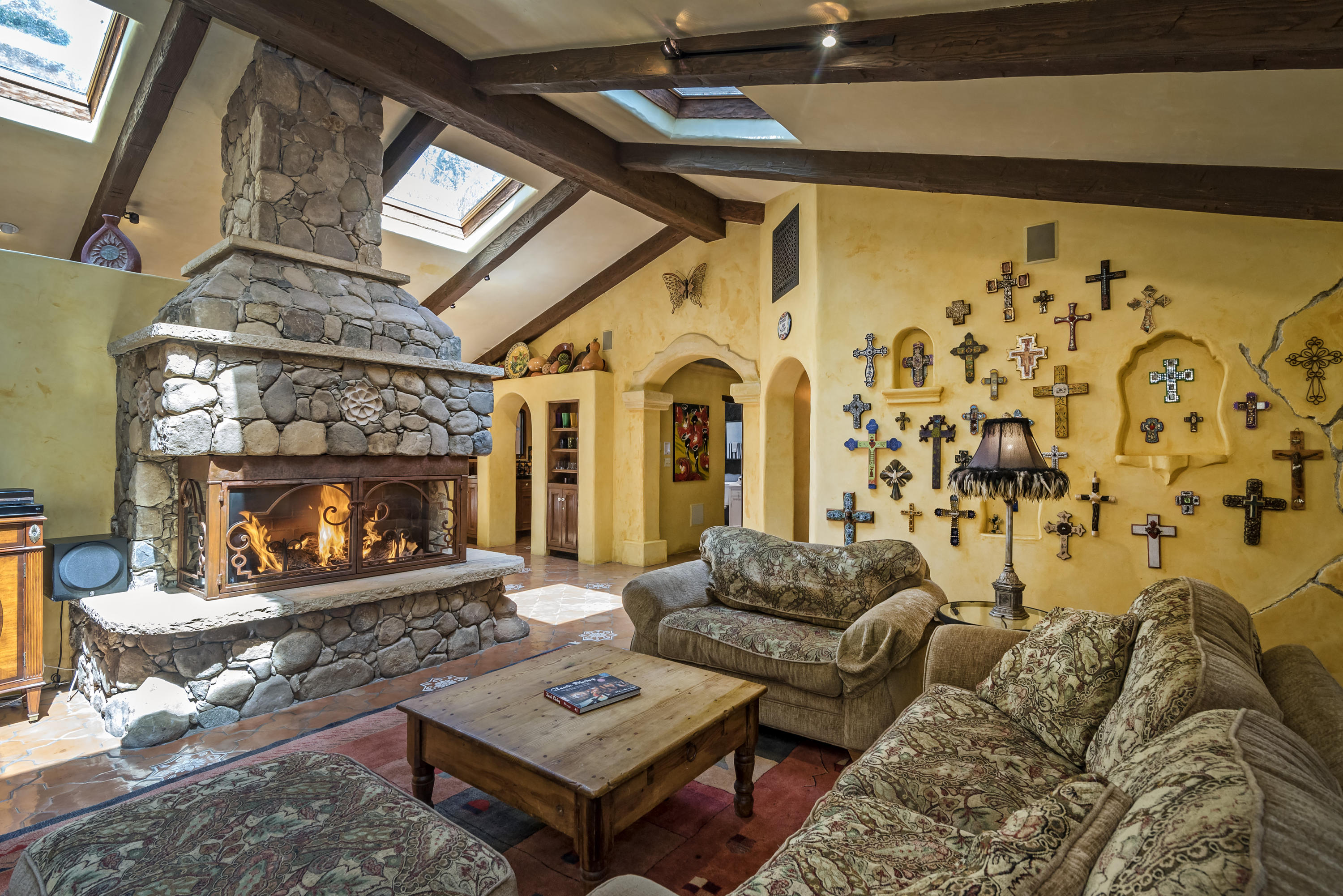 129 Grapevine Road Oak View, CA 93022 - Photo 9 of 24 a living room with furniture and a fireplace